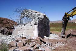 Photo of Building 520 Disassembly Work mount pier blast shield demolition.
