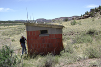 Ordnance and Explosives Safety Specialist, Harmon Slappy, inspects Building C-1553 (former black powder magazine) in Igloo Block C in Parcel 4.