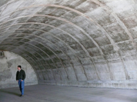 The photo shows the inside of a typical igloo also known as an earth covered magazine.