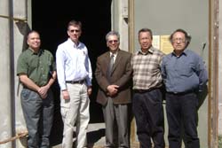 Photo of representatives from the Navajo Nation (Albert Damon left, Franklin Jishie center, and Tony Perry right) along with Richard Cruz and Steven Smith tour an igloo. 